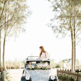 wedding photography bride and groom with a classic car