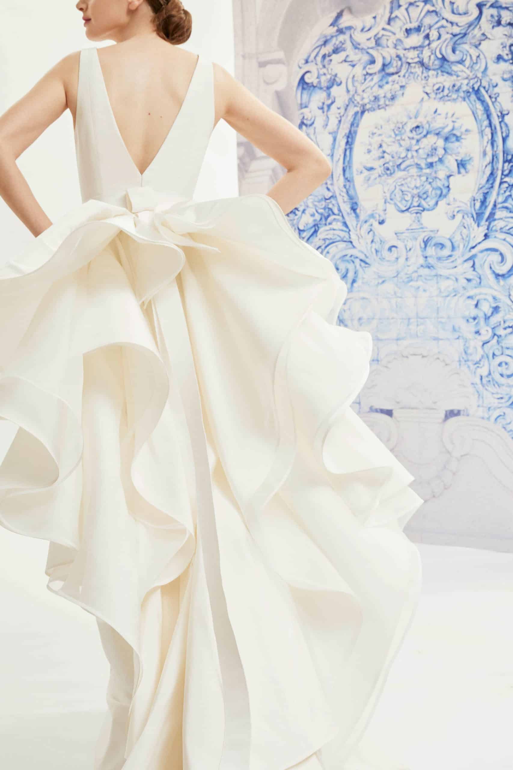 wedding dress with back bow with tail by Carolina Herrera
