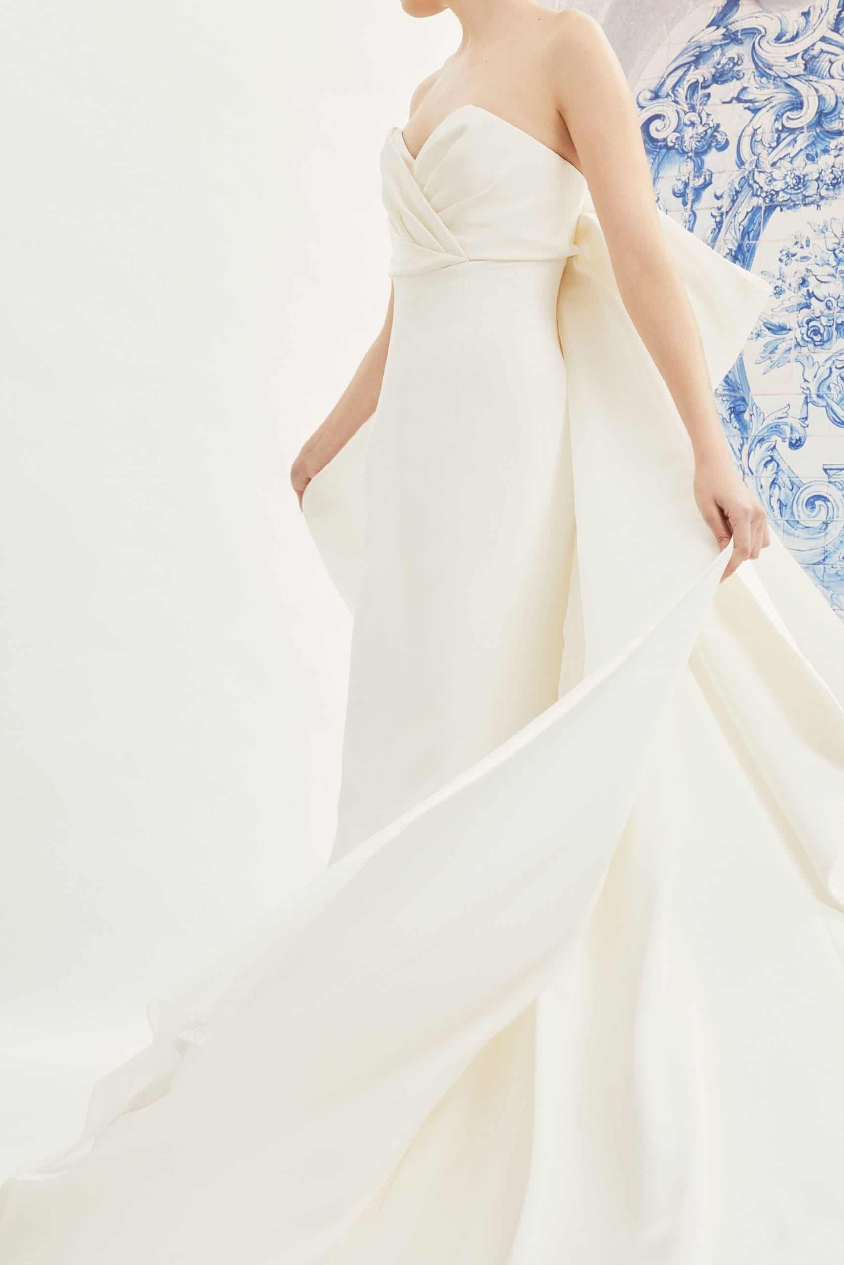 strapless wedding dress with back bow with tail by Carolina Herrera