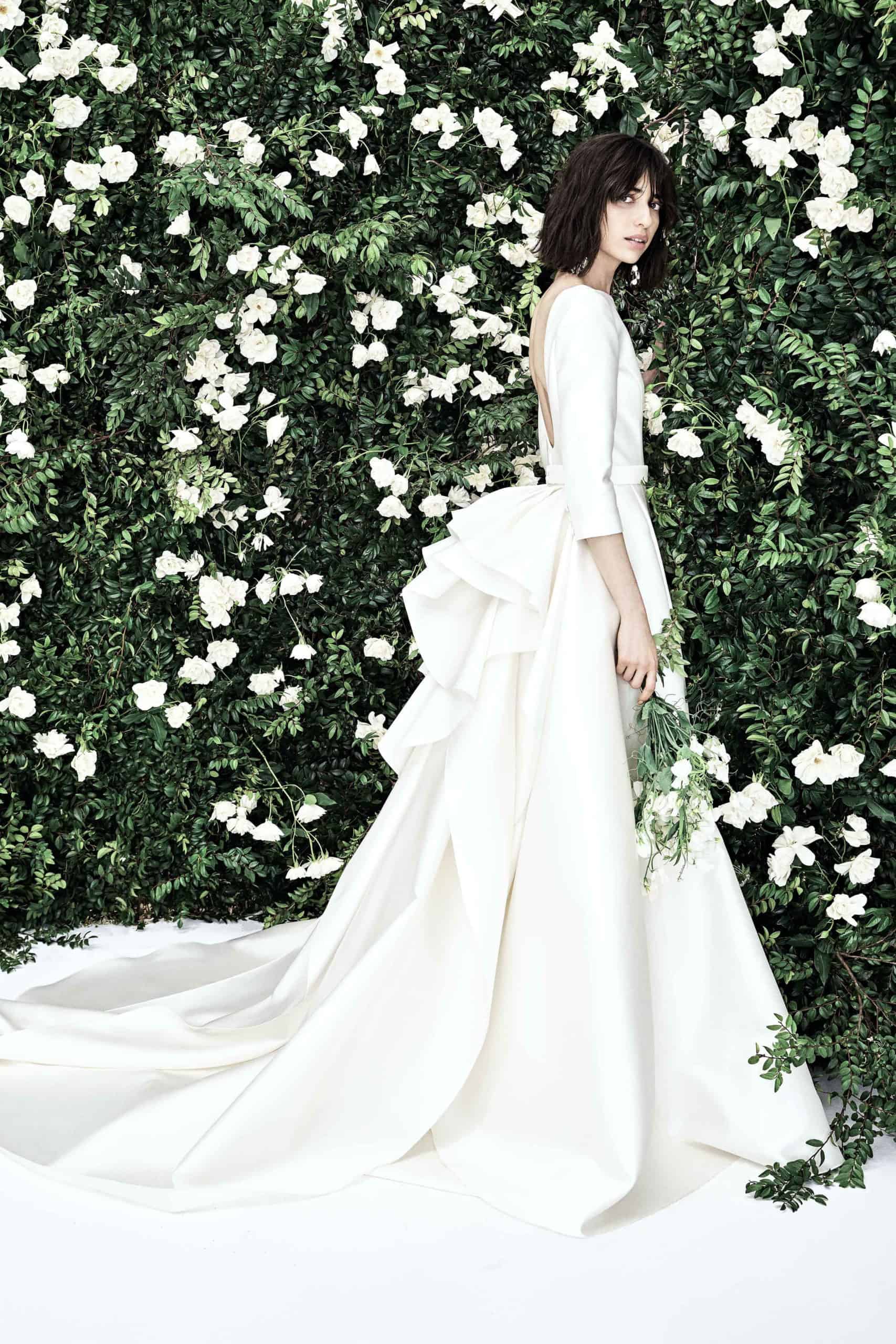 wedding dress with back bow and tail by Carolina Herrera