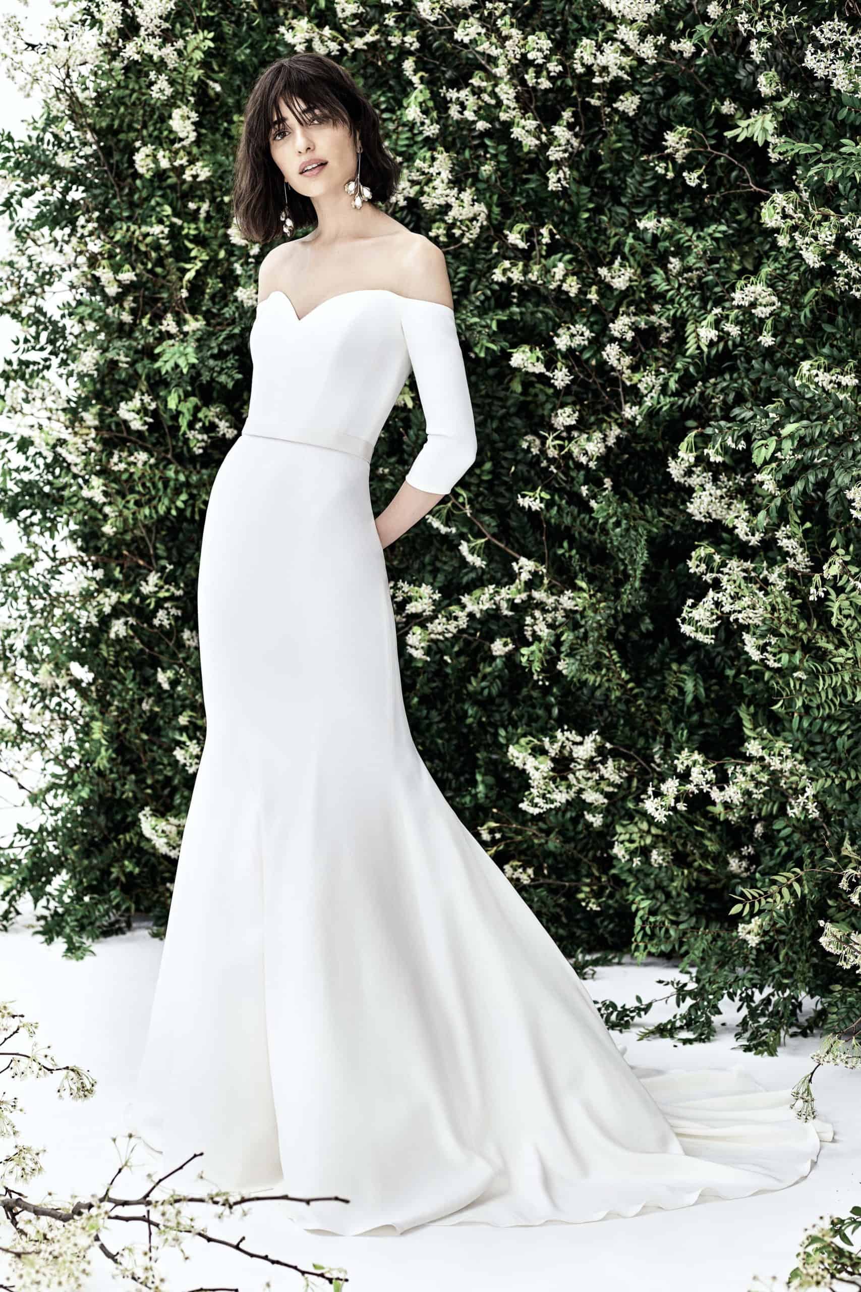satin wedding dress with long sleeves by Carolina Herrera