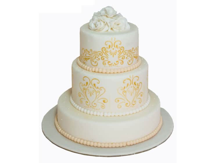 Wedding cake with yellow decorative touches, by La Parfaite Patisserie in Cyprus.