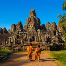 Ancient Buddhist temple ruins and two Buddhist monks, part of a honeymoon trip offered by Let's Go Tours by Amathus.