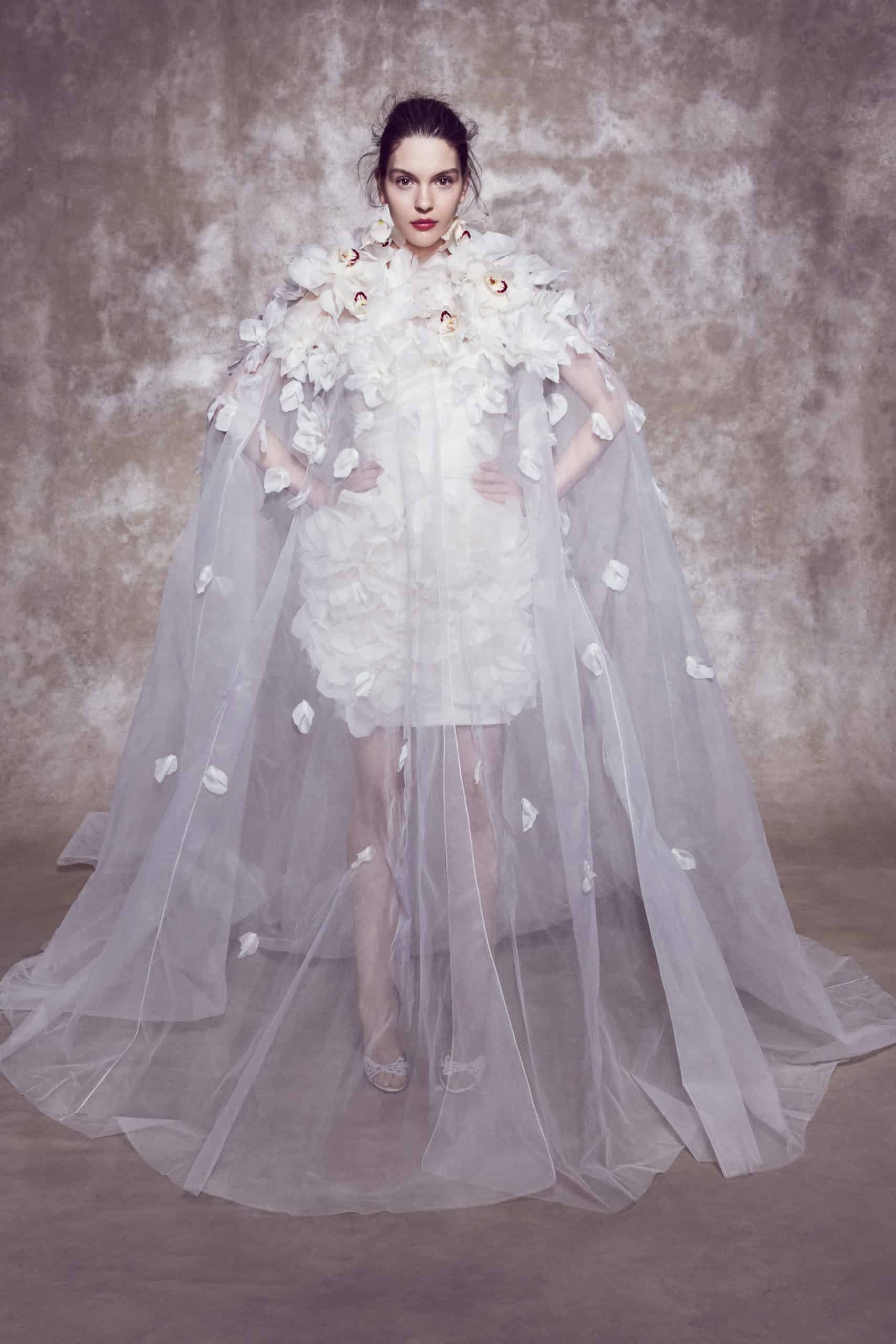 short laced wedding dress with tulle cape and 3d flowers by Marchesa