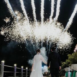 White, large firework show for a wedding, newlyweds admiring, by NightLights Fireworks.