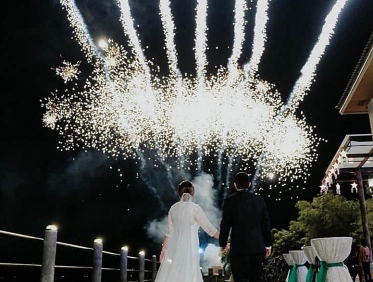 White, large firework show for a wedding, newlyweds admiring, by NightLights Fireworks.