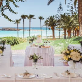 A wedding reception dinner next to the beach located at Nissi Beach Resort.