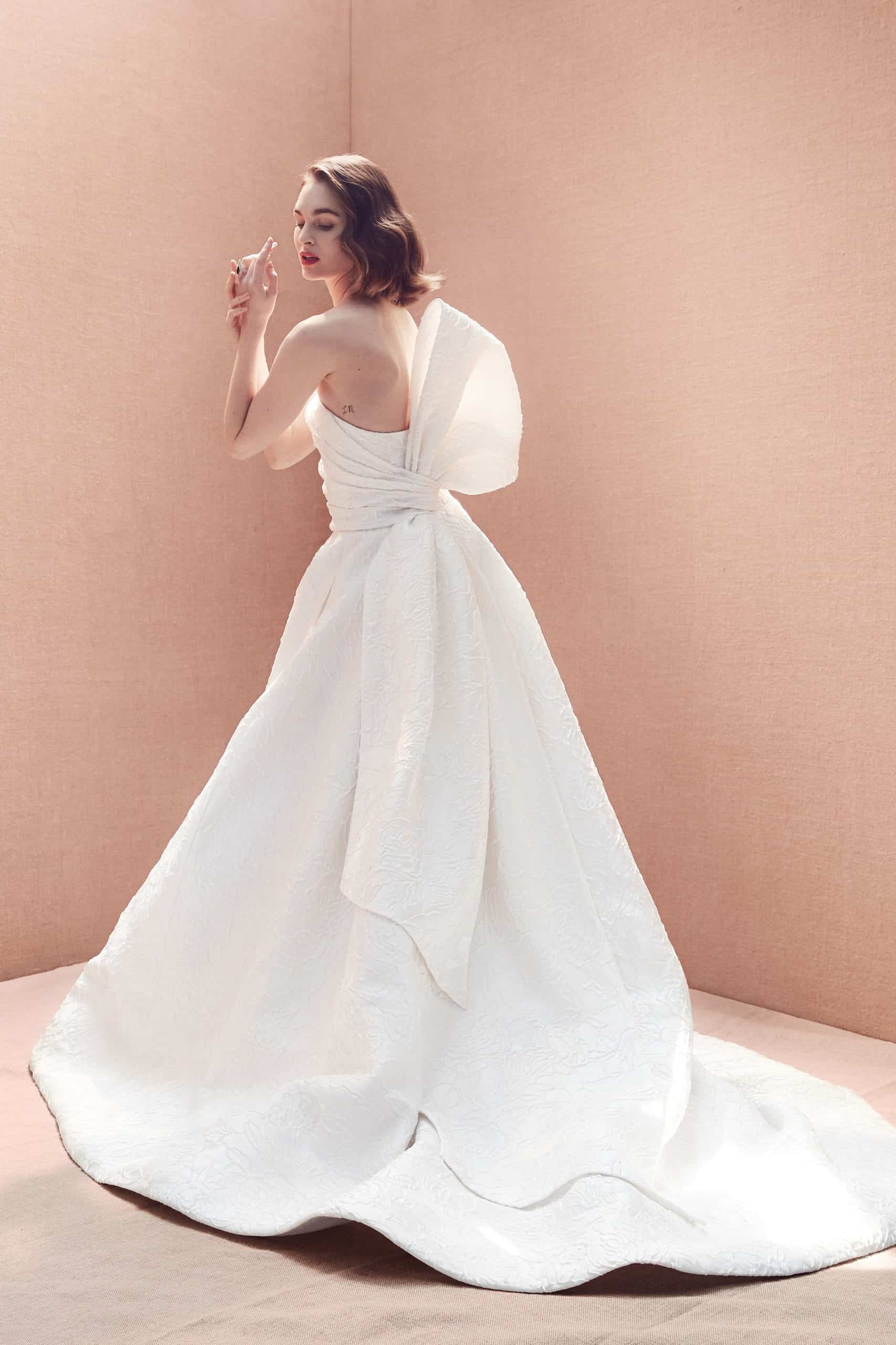 a-line strapless wedding dress with a huge back bow by Oscar de la Renta