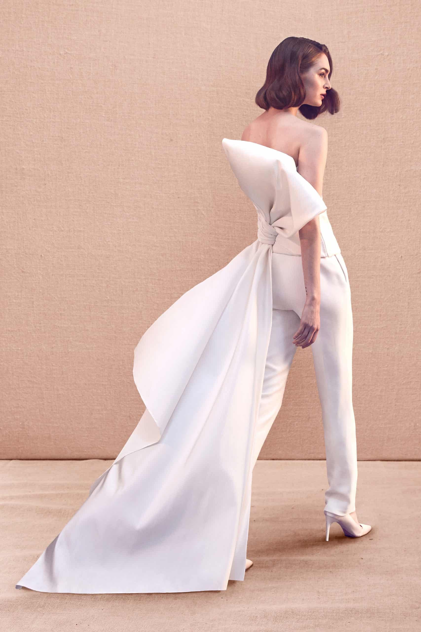 strapless wedding jumpsuit with back huge bow with a tail by Oscar de la Renta