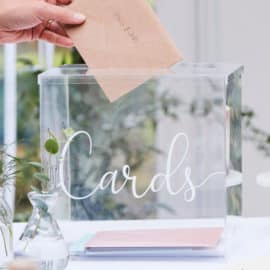 A clear plastic box for wedding Thank You cards, offered by Pergamos Wedding Decorations in Cyprus.