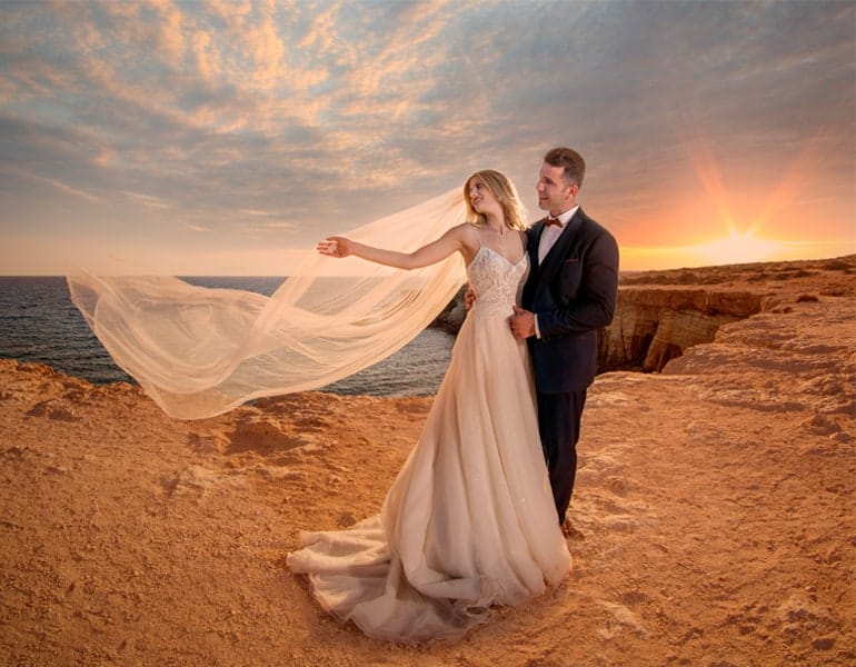 Well-edited photo of an engaged couple at seaside cliffs, by Studio Ena.